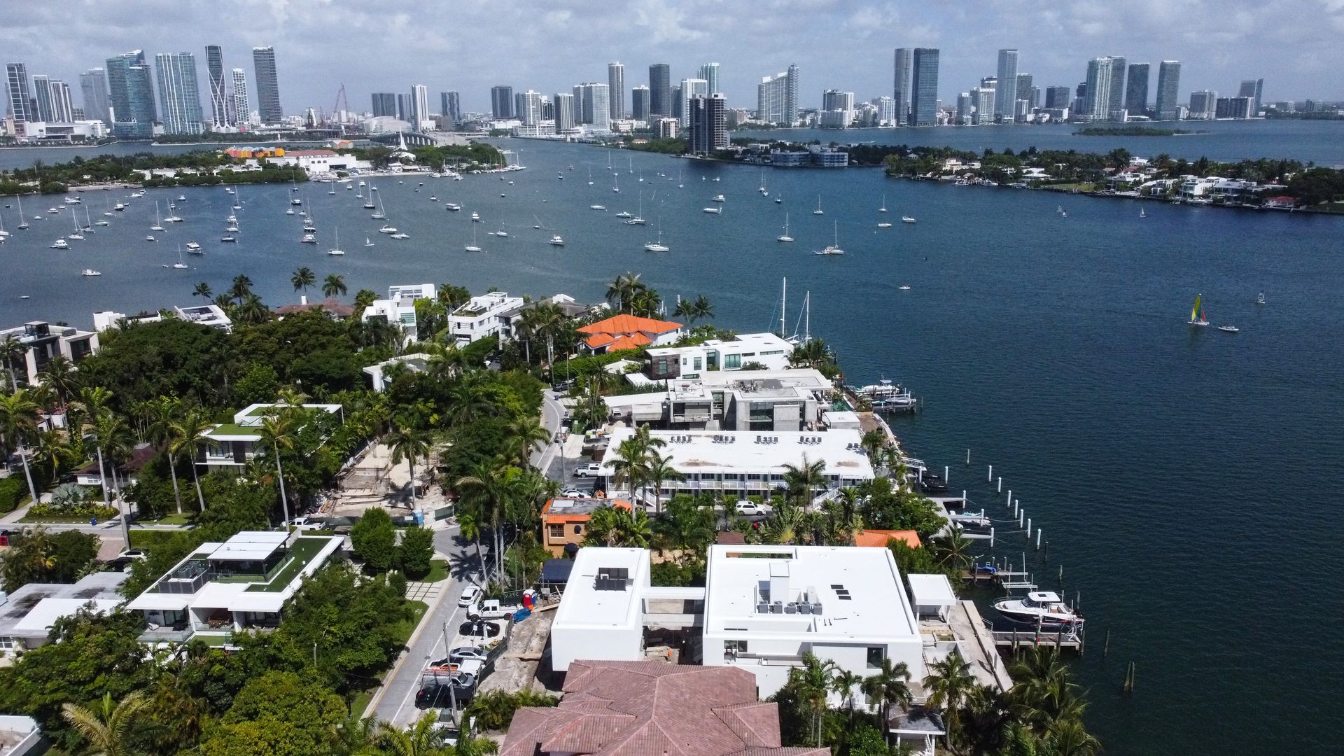 An aerial view of a large body of water with a city in the background