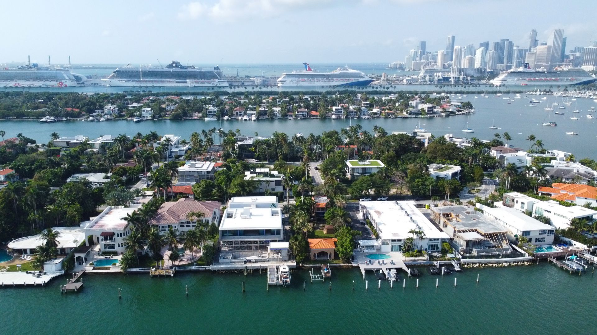 An aerial view of a large body of water with a city in the background