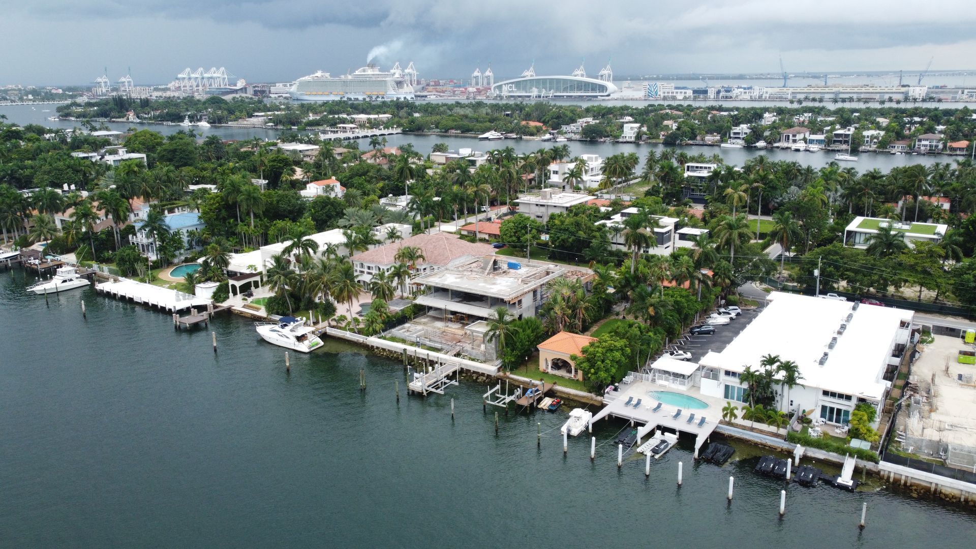 An aerial view of a residential area next to a body of water