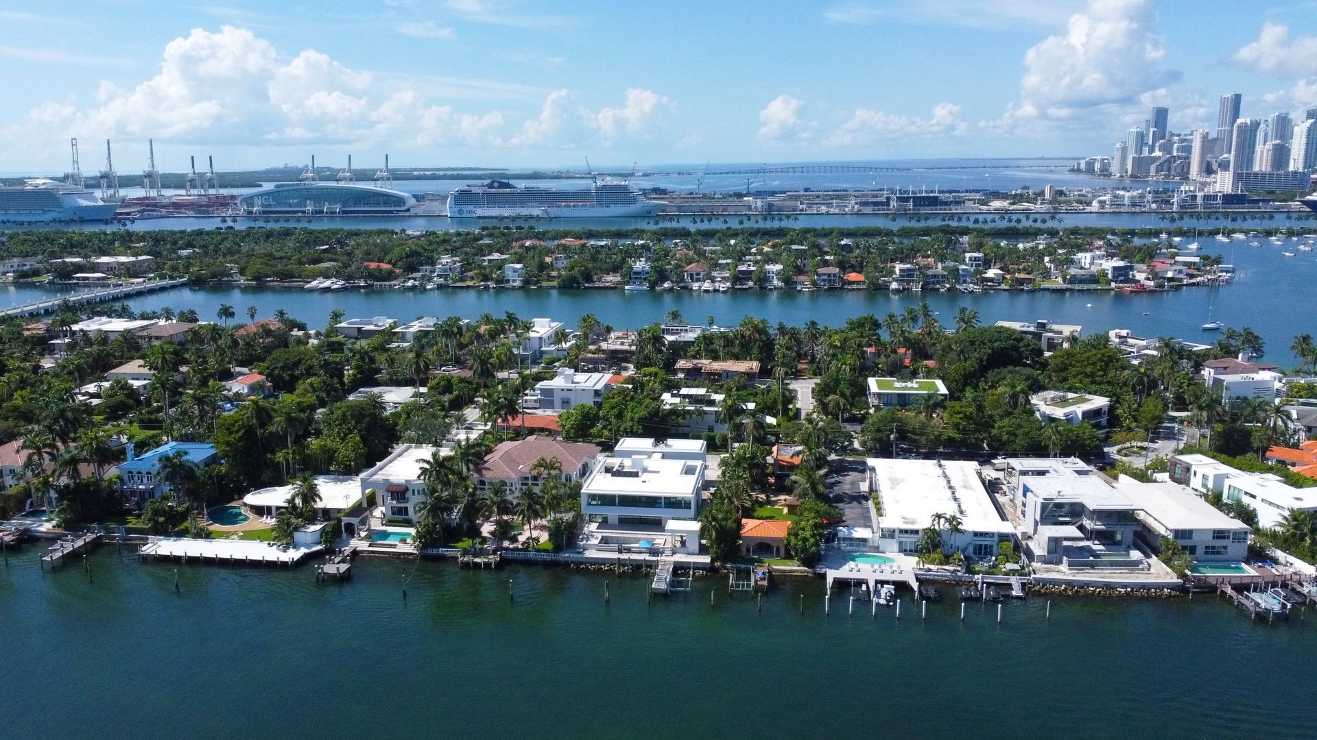 An aerial view of a residential area next to a body of water