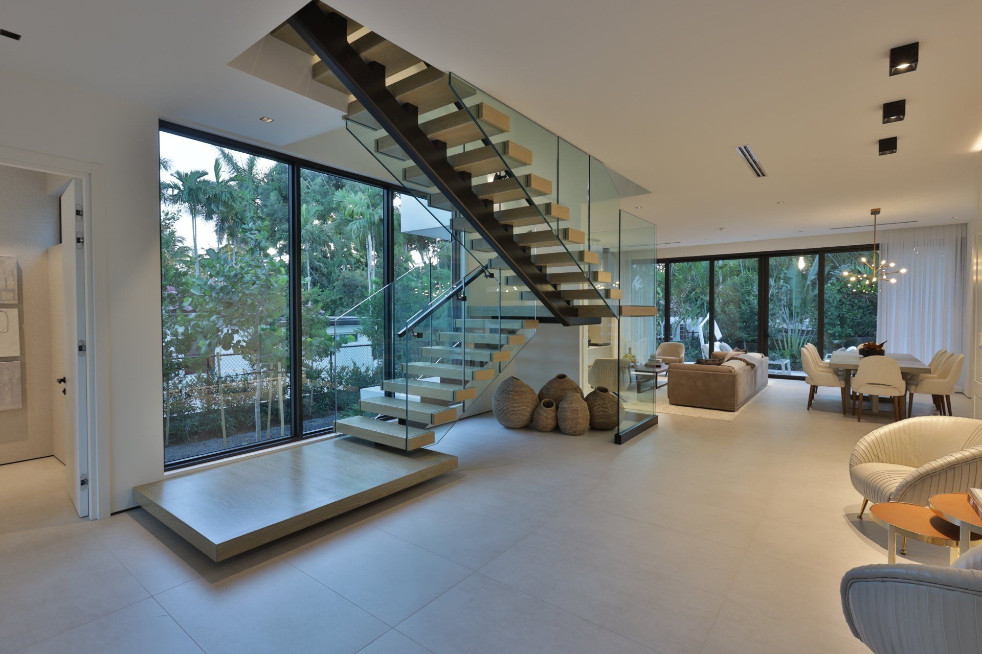 A modern house with a staircase and lots of windows