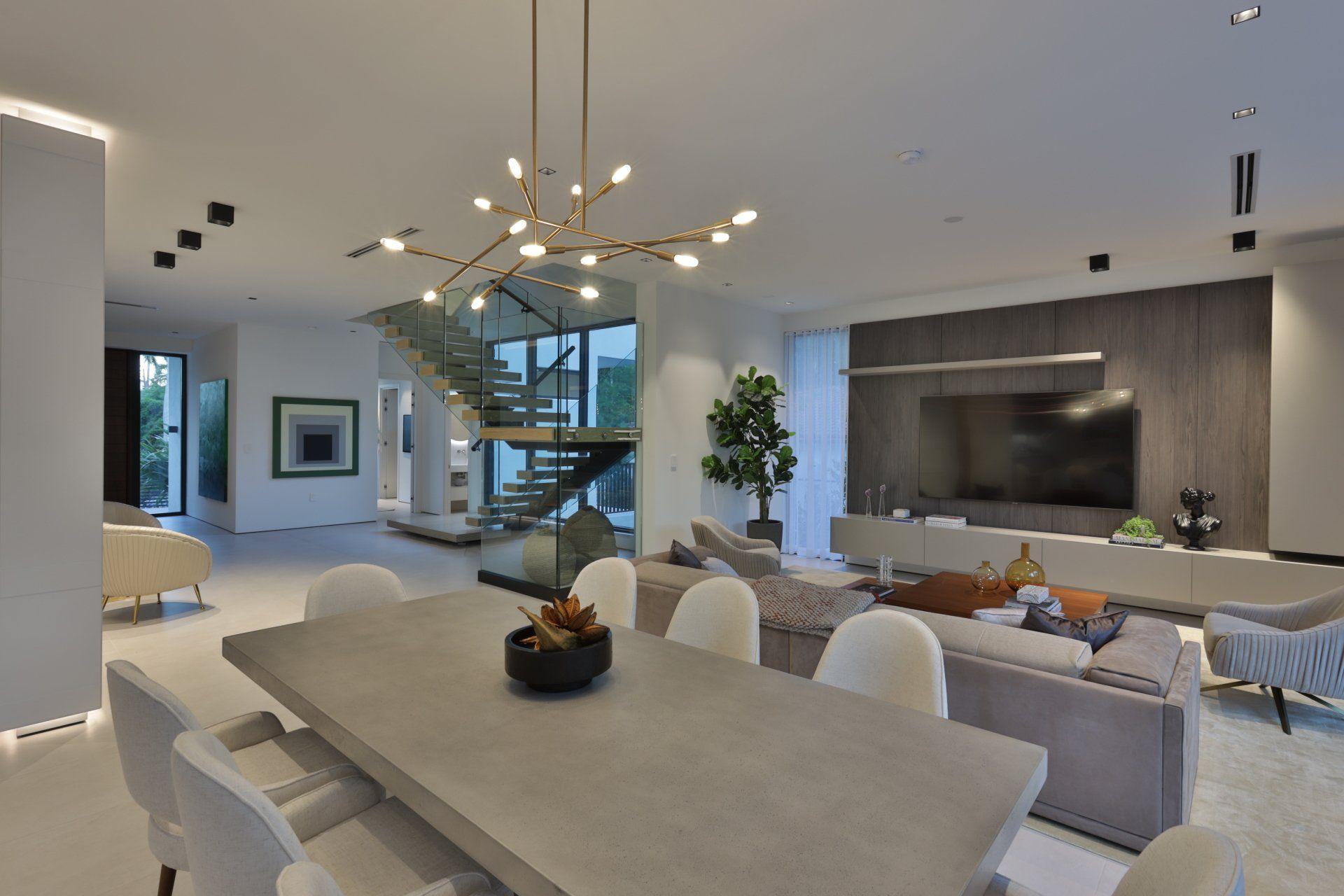 There is a dining table in the middle of the room.