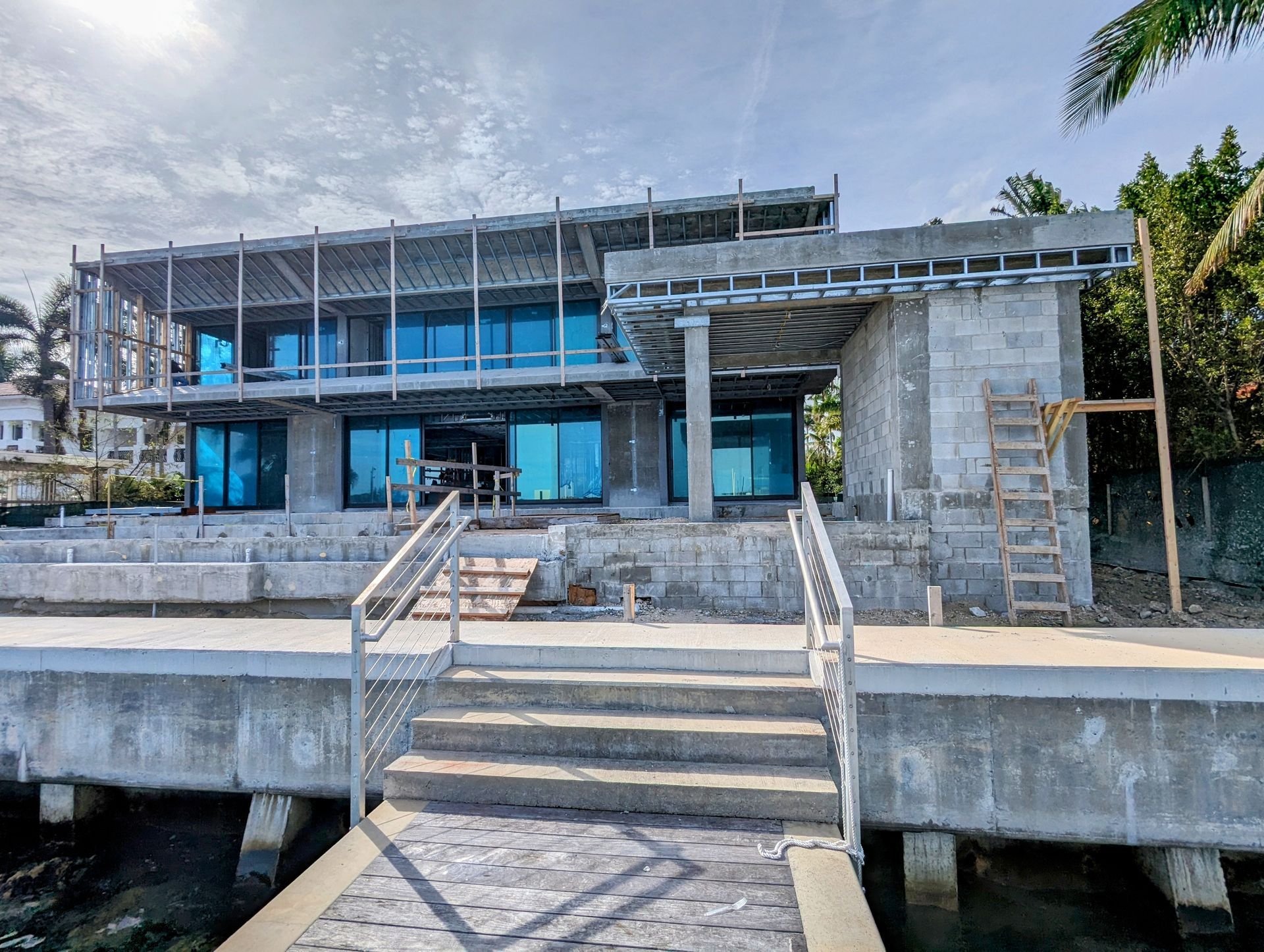 A large building under construction with stairs leading up to it