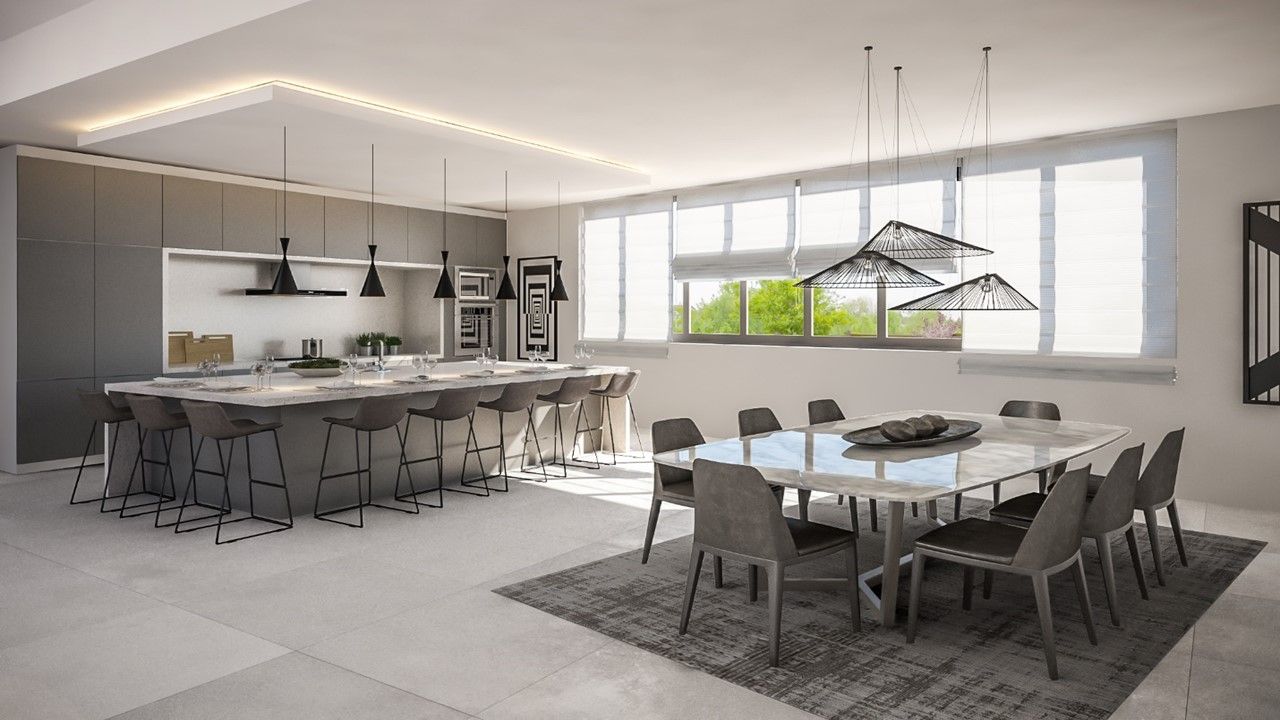 Modern kitchen/dining area with large island, dining table, and large windows. Gray and white color scheme.