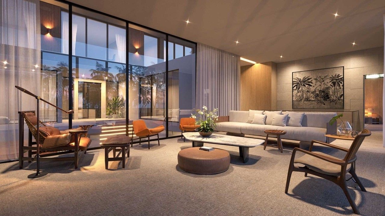 Upscale living room with large windows, modern furniture, and a fireplace.