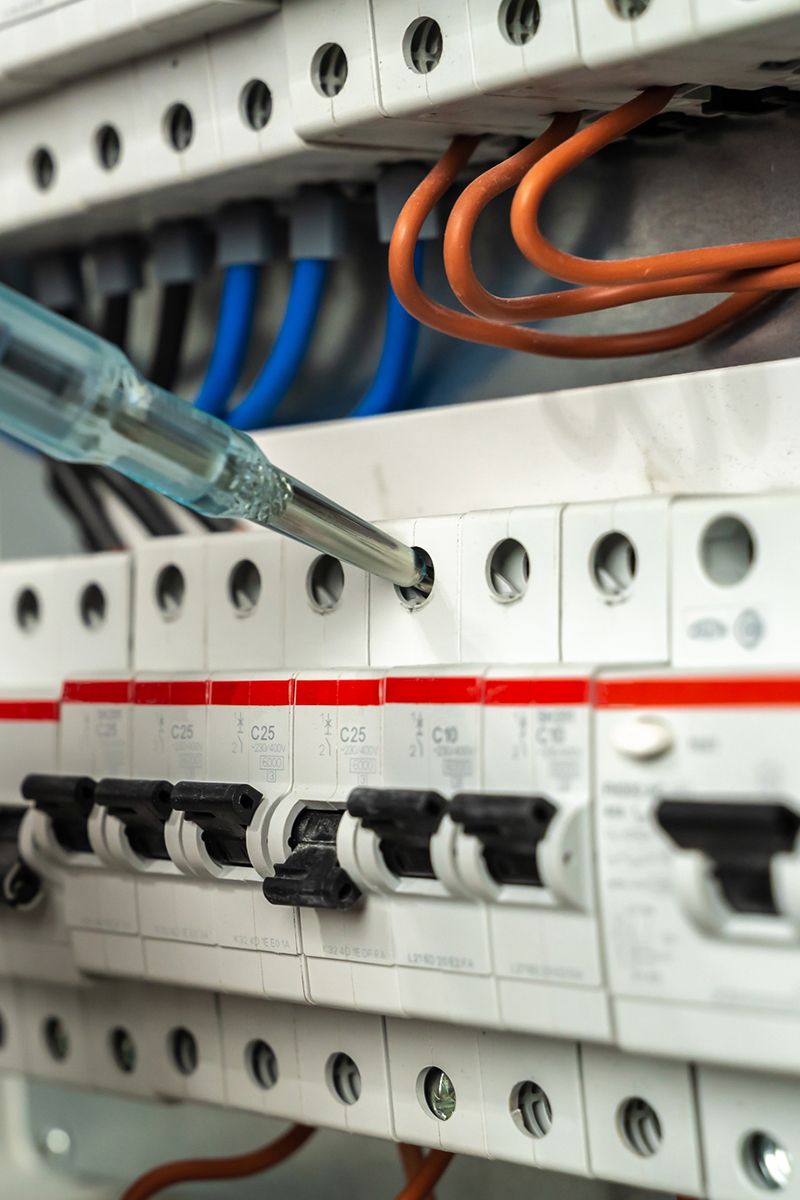 Electrician Testing Fuse Box — Corpus Christi, TX — Synergy Home & Commercial Services