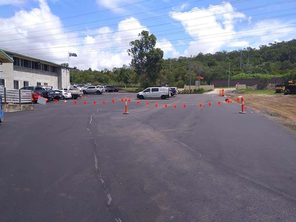 A parking lot with a lot of cars parked in it
