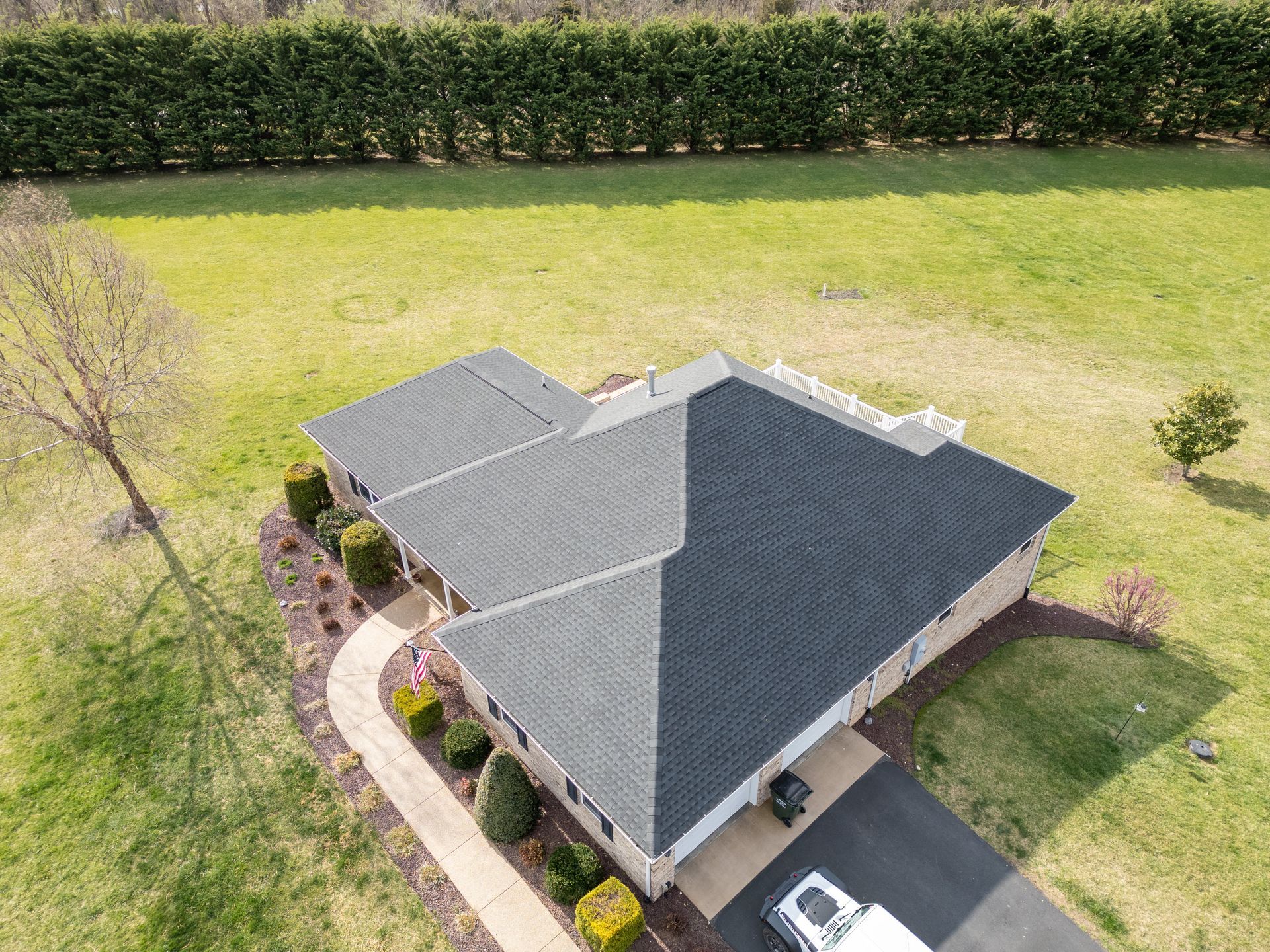 Aerial or drone shot of a residential Waynesboro home with a clean architectural shingle roof