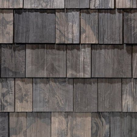 A close up of a wooden shingle roof.