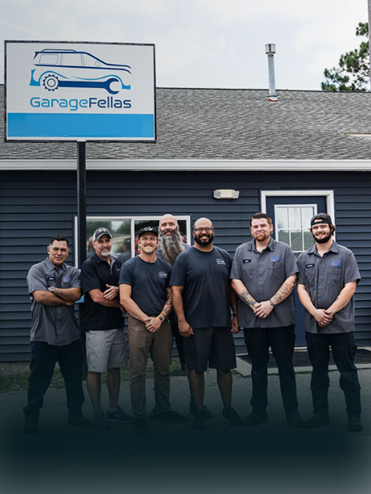 silver car on lift | GarageFellas of Wilmington