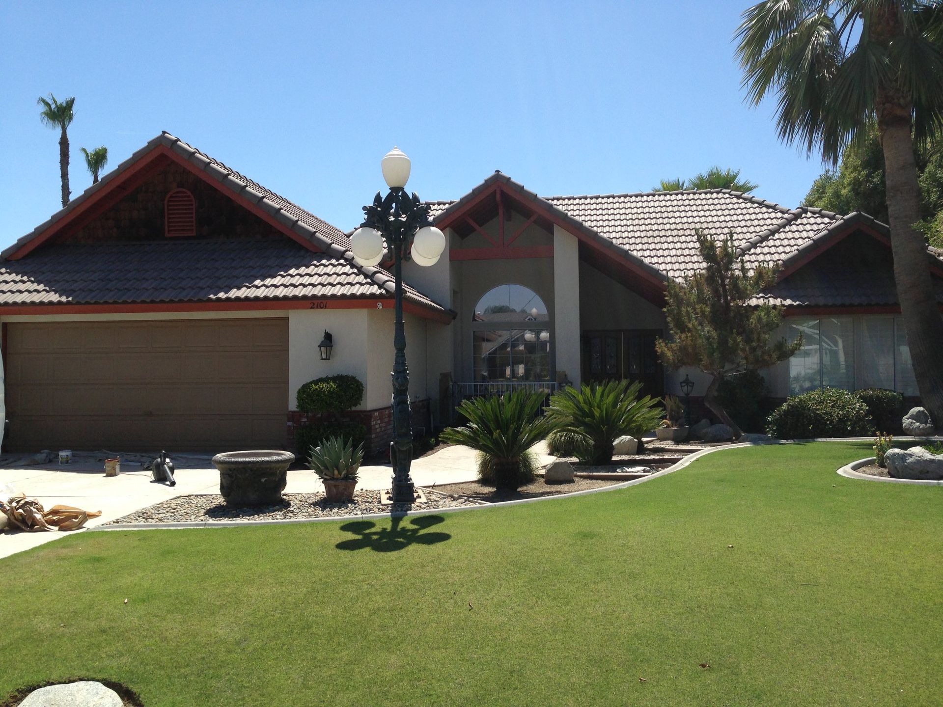 A large house with a large lawn in front of it