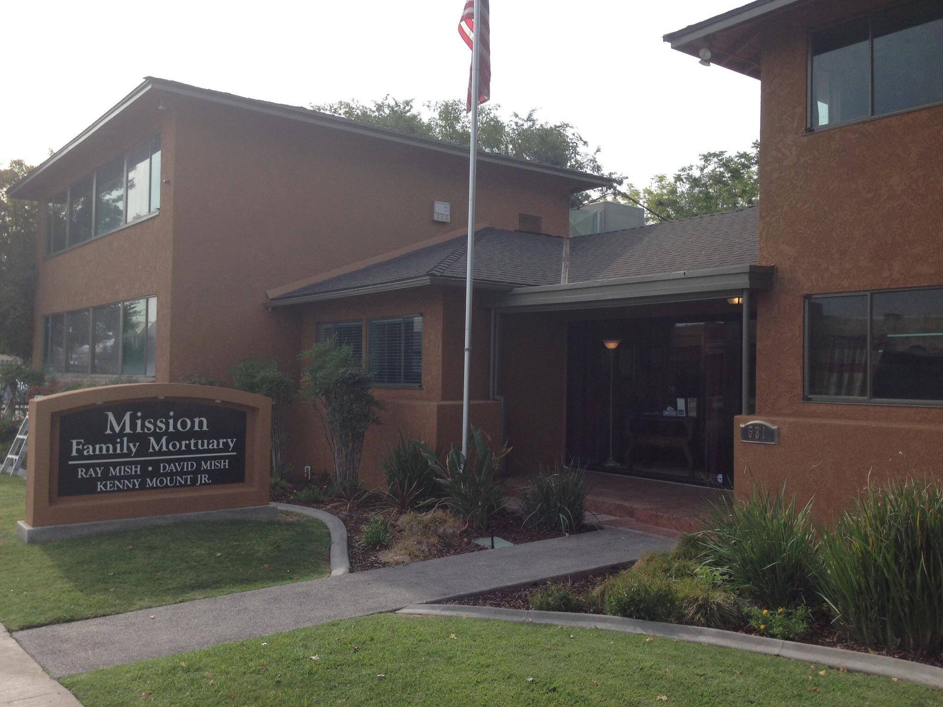 A mission family ministry building with a flag in front of it