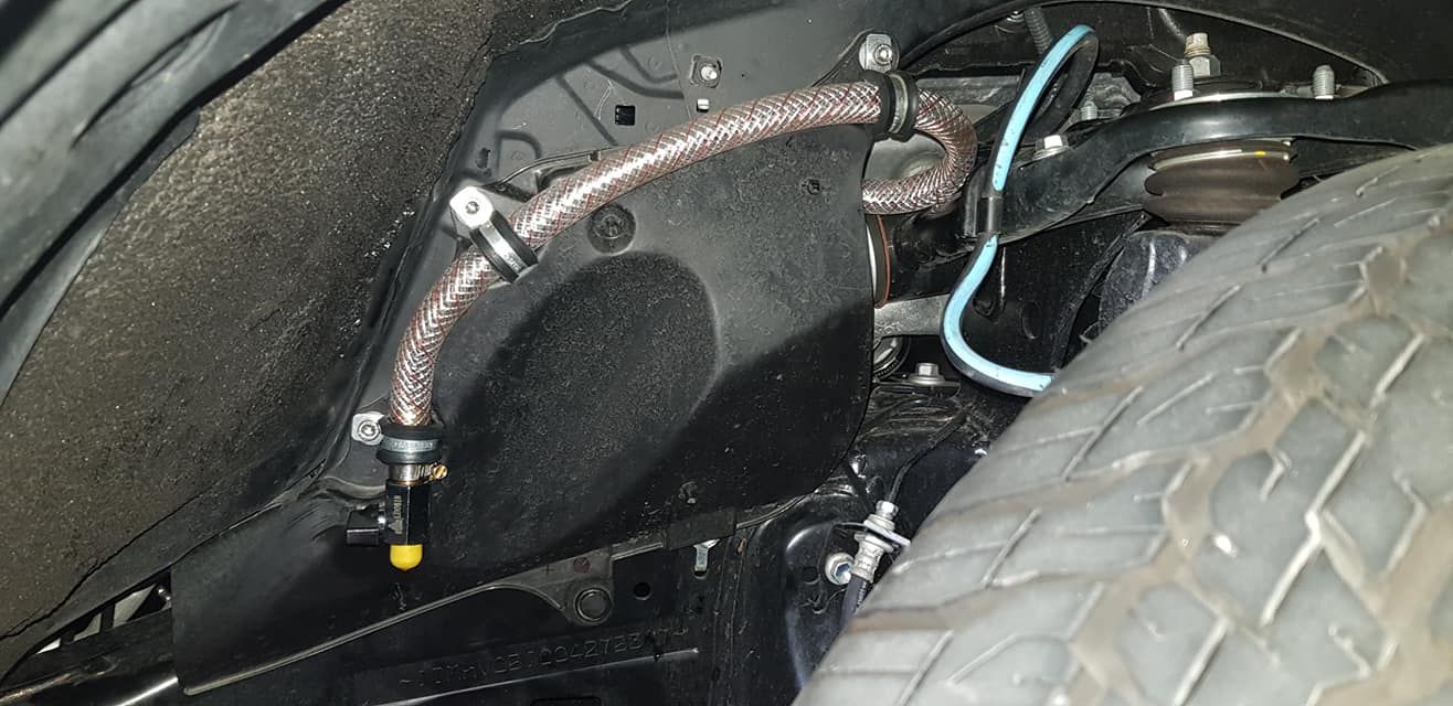 A Close Up of a Tire With a Hose Attached to It — Drinnan's Diesel & Automotive Repairs In Gladstone Central, QLD