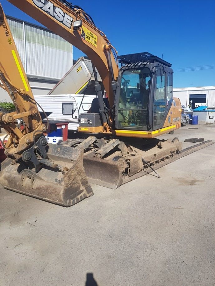 A Case Excavator is Parked in a Parking Lot — Drinnan's Diesel & Automotive Repairs In Gladstone Central, QLD