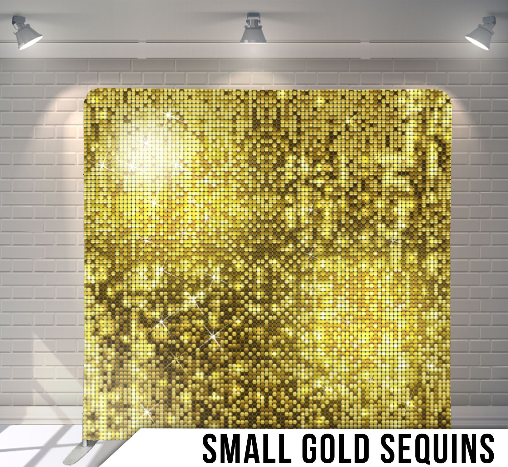 A small gold sequins backdrop is sitting on a white brick wall.