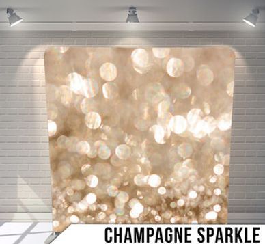 A picture of a champagne sparkle backdrop in a room.