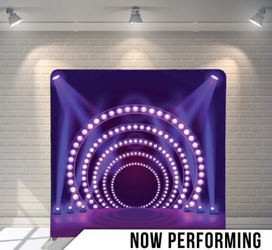 A stage with purple lights and the words `` now performing '' on the bottom