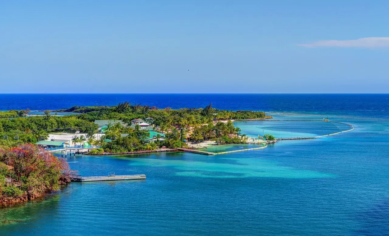 An aerial view of a small island in the middle of the ocean.