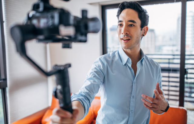 man holding a camera pointed at himself