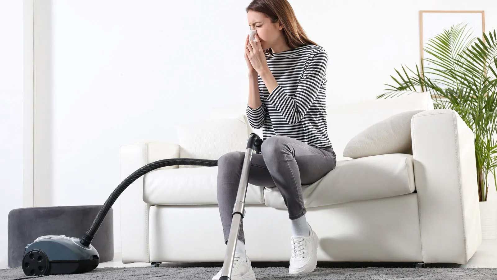 Woman on the sofa with Allergies need Deep Cleaning Service NYC