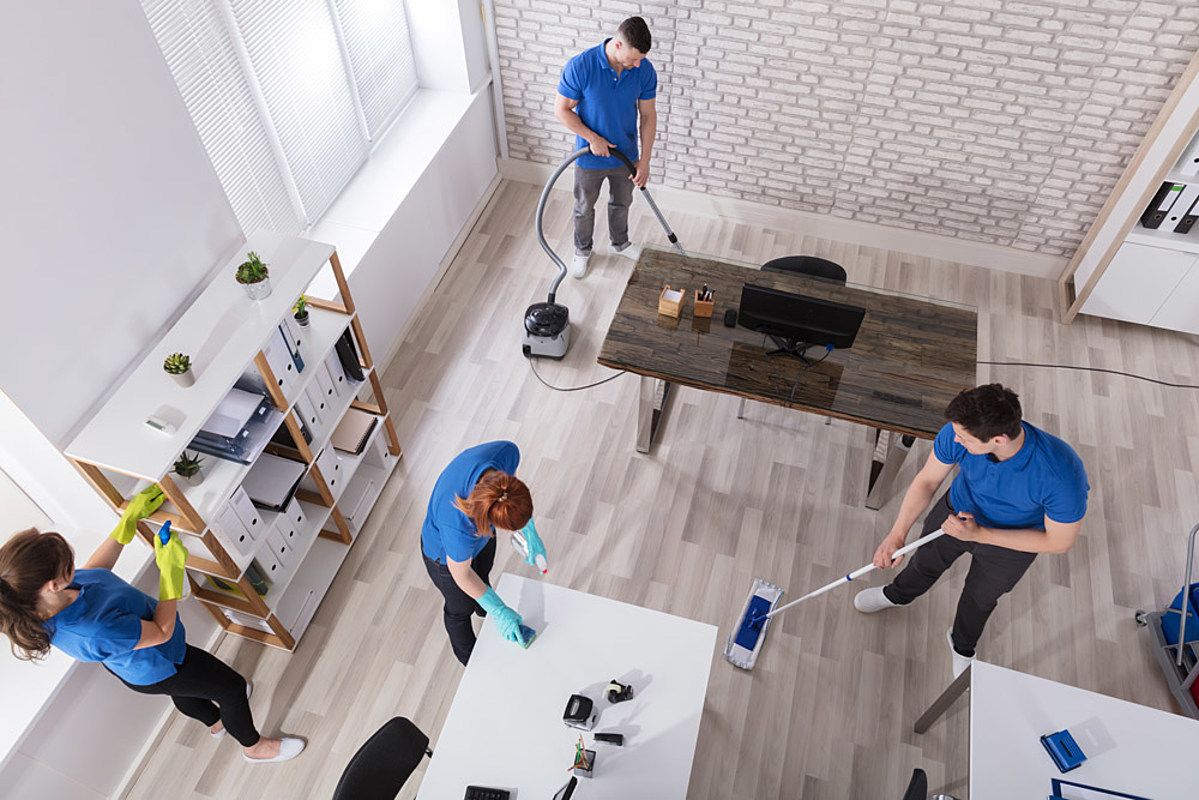 A group of people doing office cleaning and provide office maintenance services.