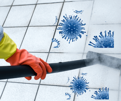 a person wearing orange gloves is cleaning a tiled floor with a vacuum cleaner
