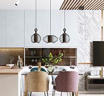 A kitchen with a table and chairs and a television.