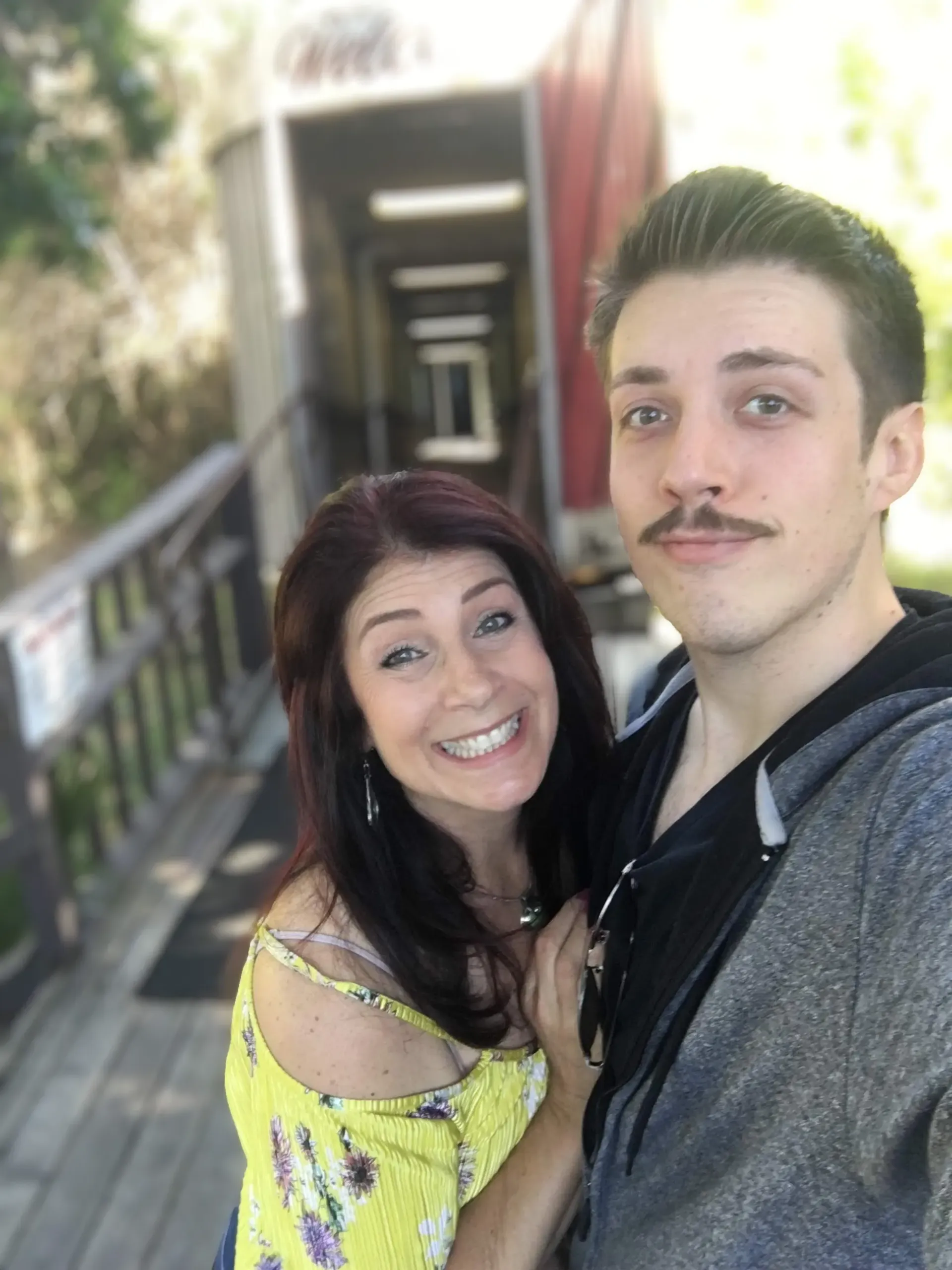a man and a woman are posing for a picture together .
