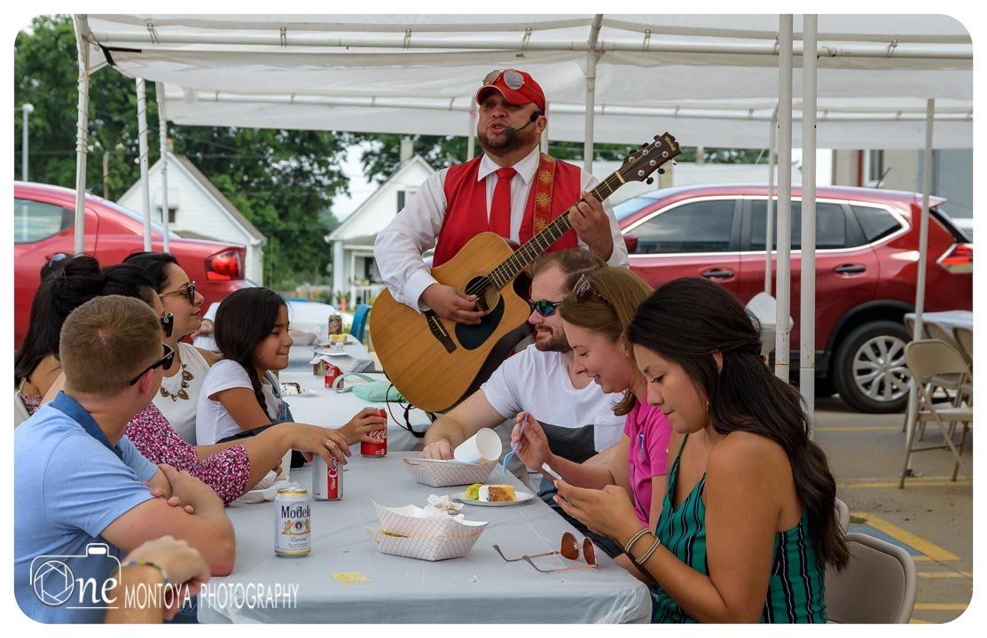 guy singing in front of the  table