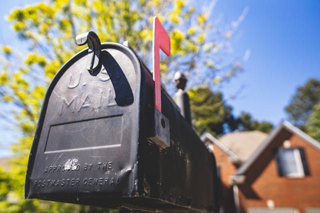 a black mailbox outside of a property