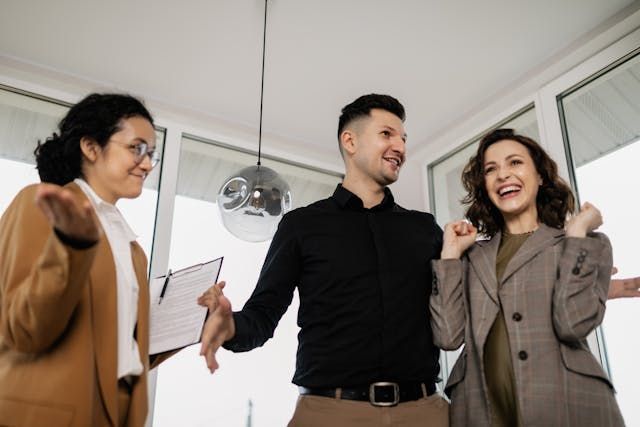 a property manager speaking with two new tenants