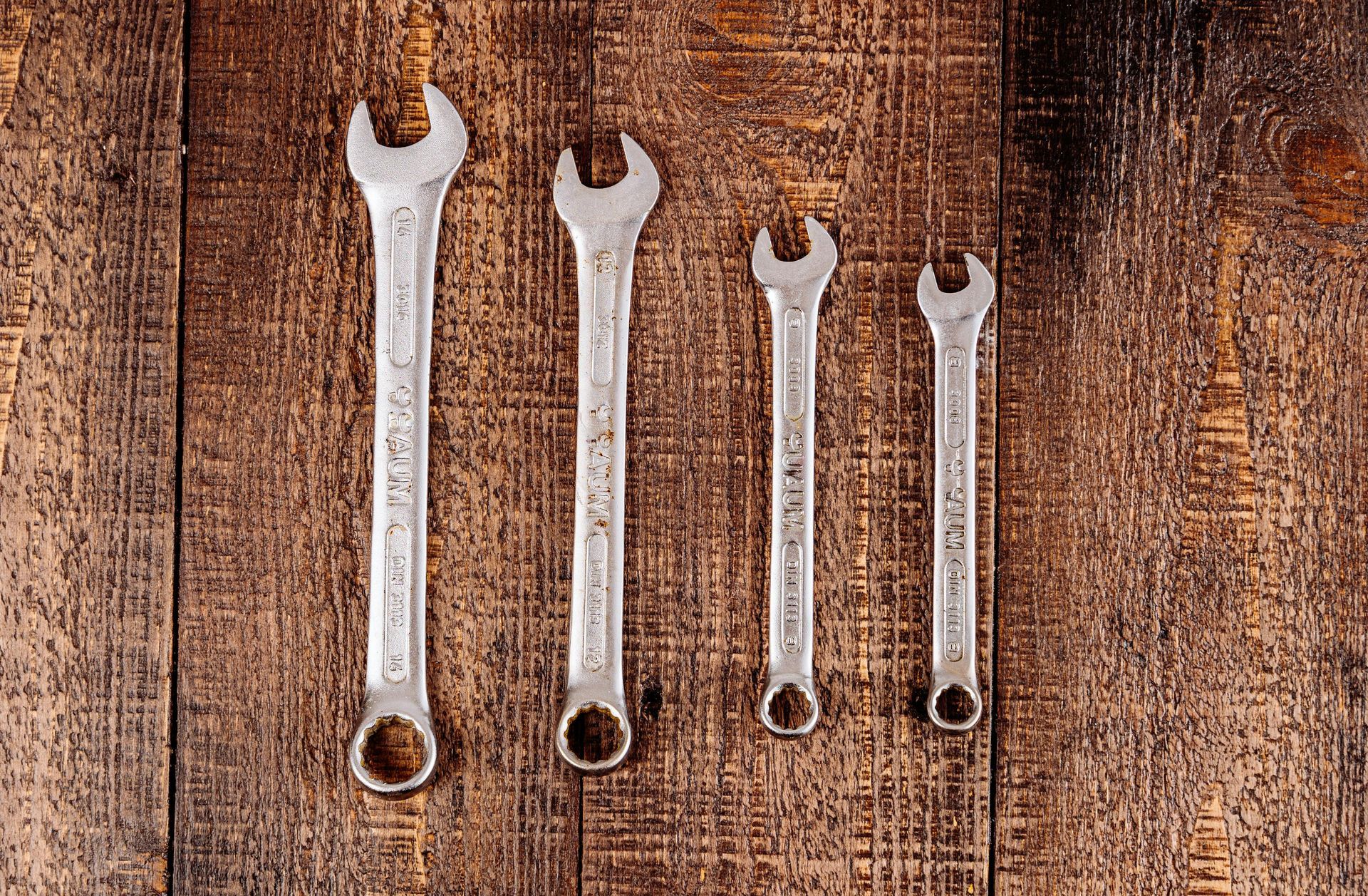 four wrenches in a line