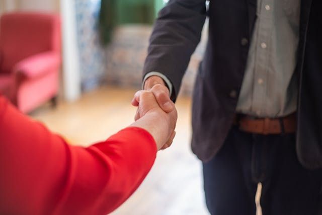 a California landlord and tenant shaking hands