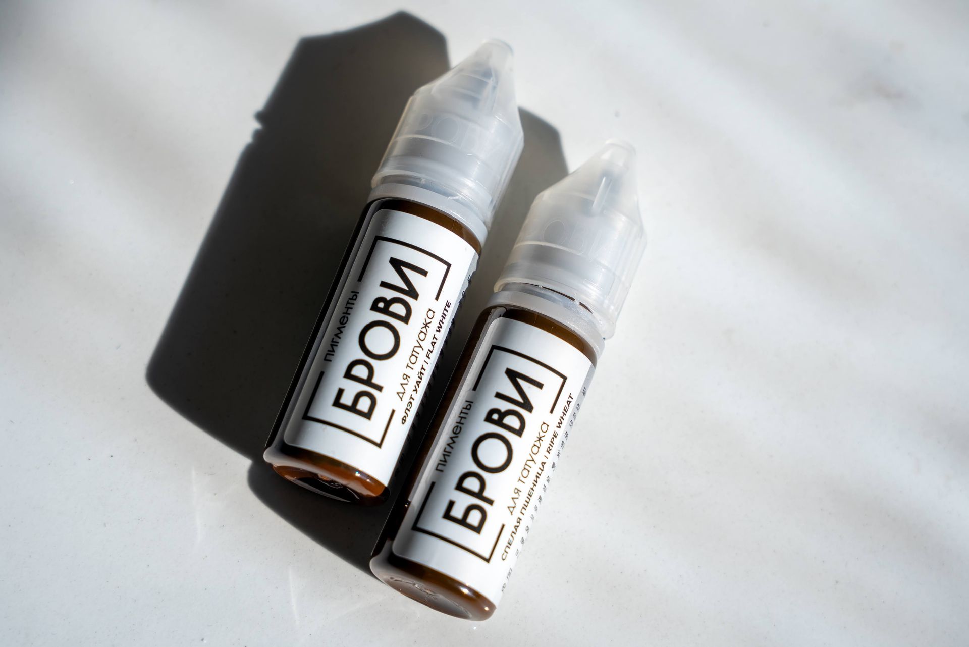 Two small brown bottles labeled 