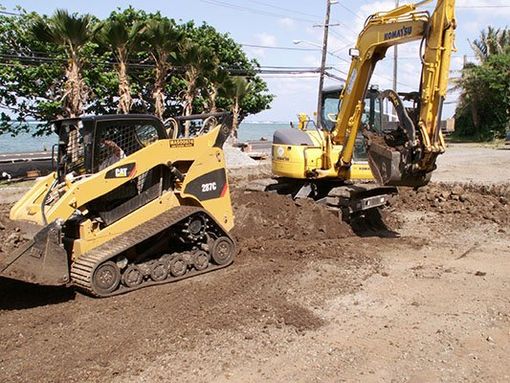 Construction machines digging a hole