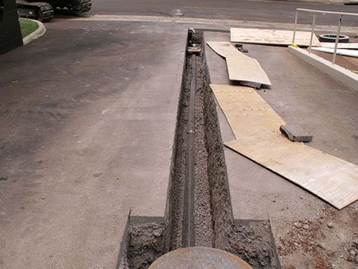 Straight line digging under cement
