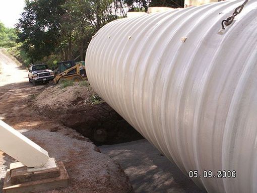 Placing waster water tank into cement hole