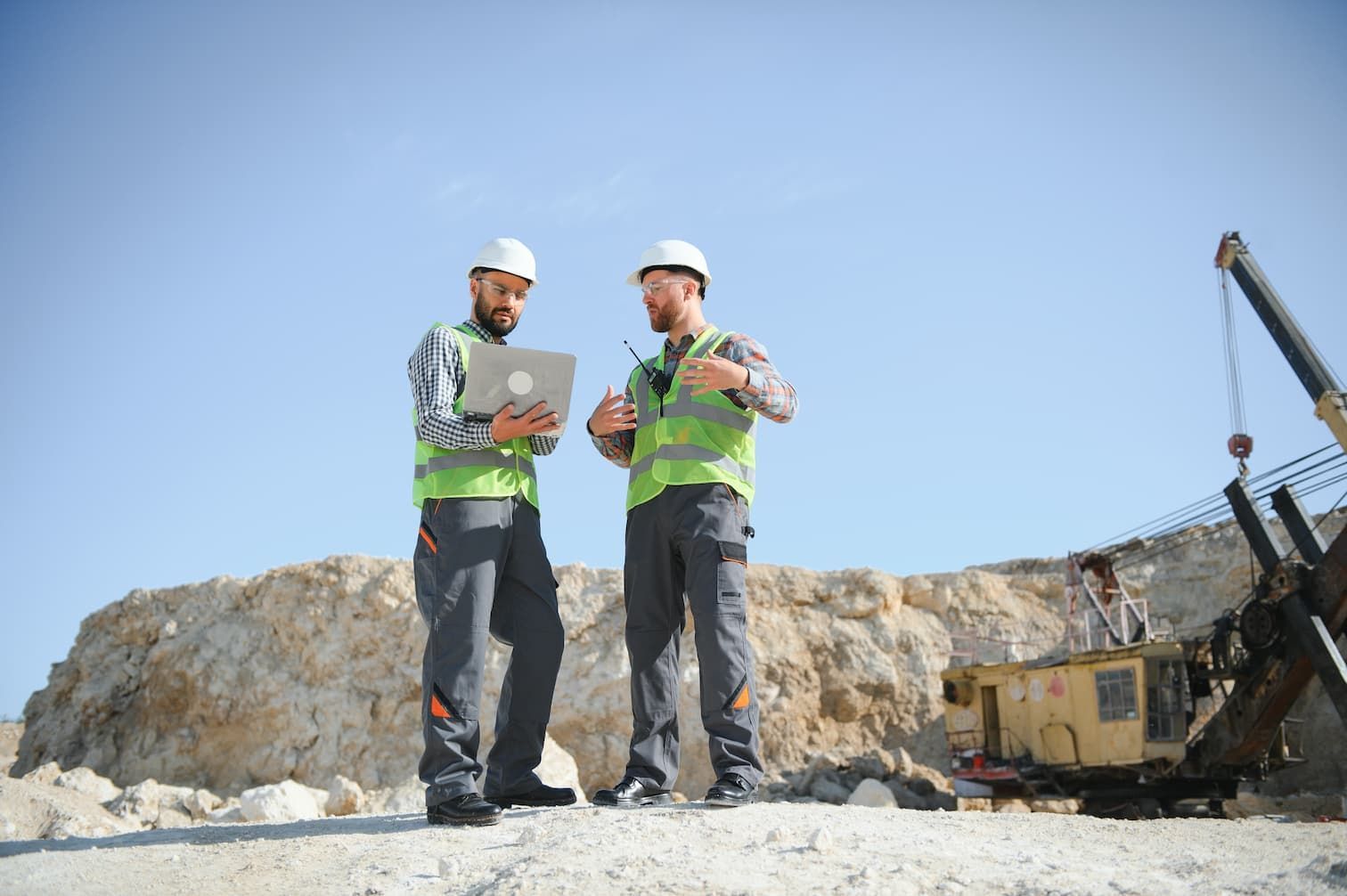 Two construction workers in safety vests and helmets — Tewantin Medical Centre In Tewantin, QLD