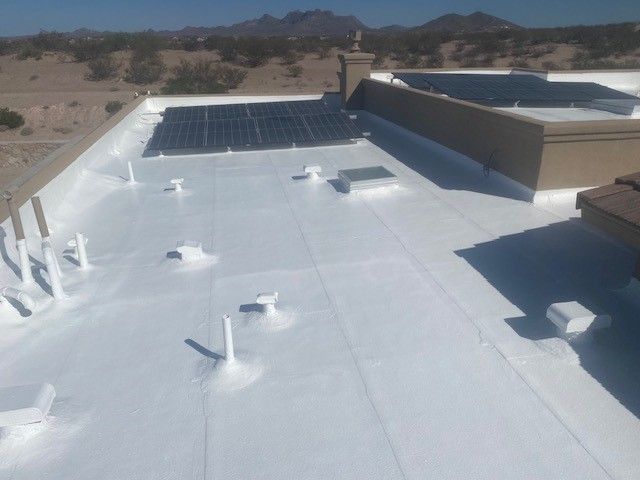 A white roof with solar panels on it