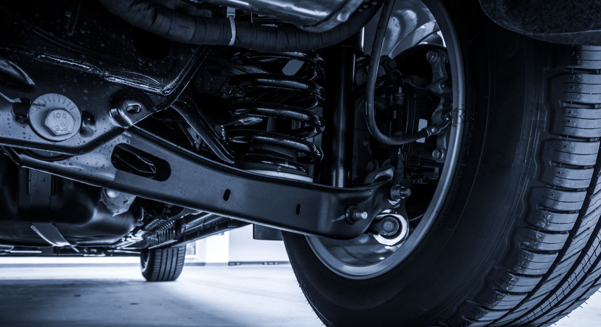 A Close Up of the Underside of a Car With a Tire — Zilzie Workshop In Emu Park, QLD