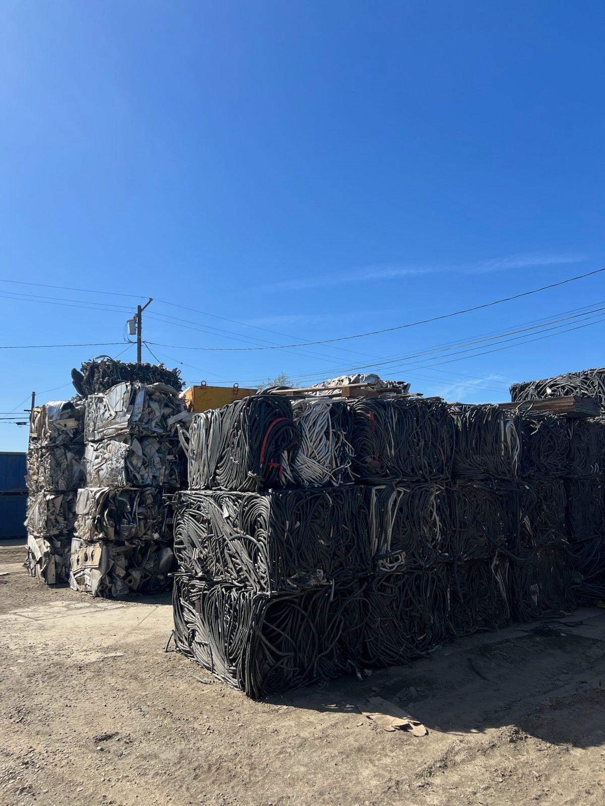 A bunch of blocks stacked on top of each other in a dirt field.