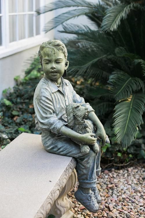 Statue on bench at Emmerson-Bartlett Memorial Chapel in Redlands, CA