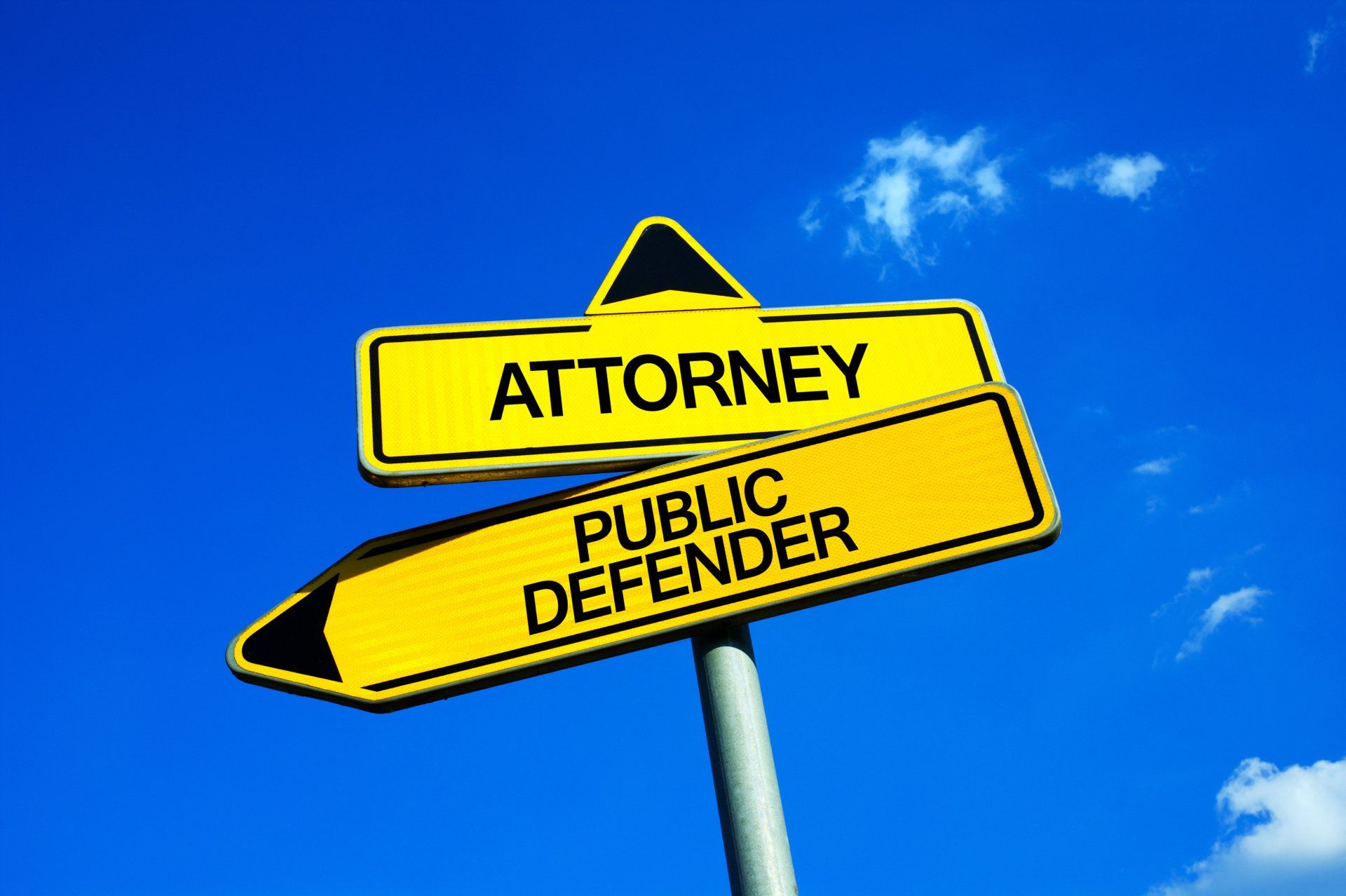 street signs saying attorney and public defender