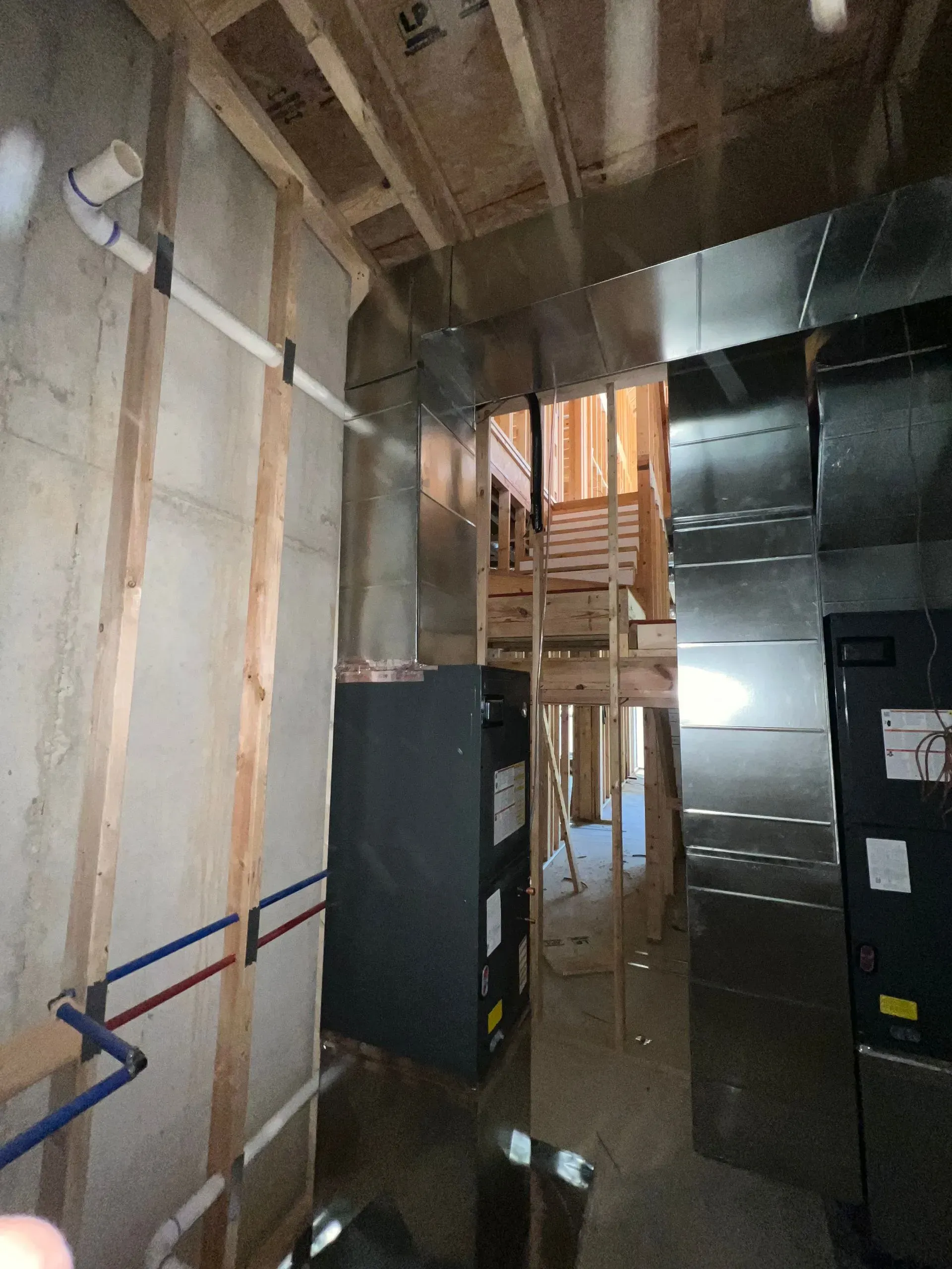 A room with a lot of pipes going through it