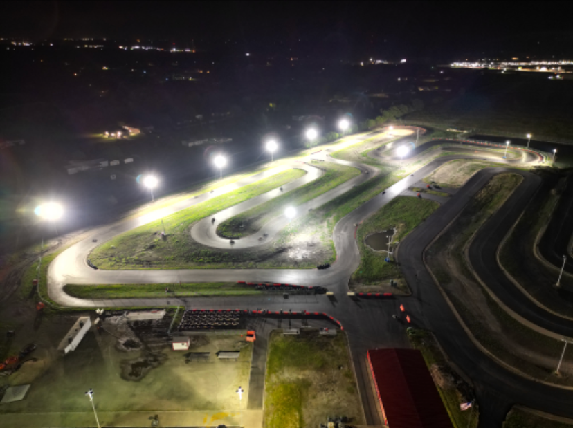 An aerial view of a race track at night.
