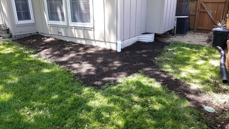house with dirt and grass