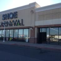 Storefront of Shoe Carnival in a shopping plaza with large windows and beige exterior