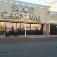 Shoe Carnival storefront in a shopping plaza with large sign and glass windows