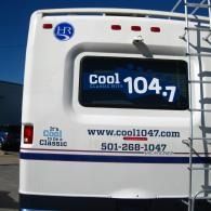 Cool 104.7 radio station truck with logo, website, and phone number on the side