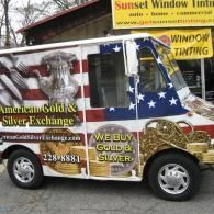 Branded van for American Gold Silver Exchange and Sunset Window Tinting, wrapped in gold, silver, and American flag graphics.